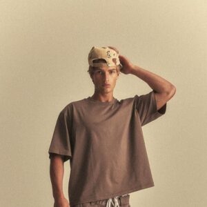 oversized streetwear T-shirt featuring a trendy premium graphic design, modeled in a modern urban fashion.